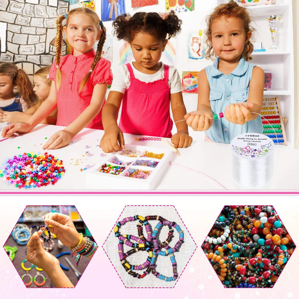 Children making bracelets with colorful beads and clear elastic string on a white table, with a spool of string and beading supplies visible.