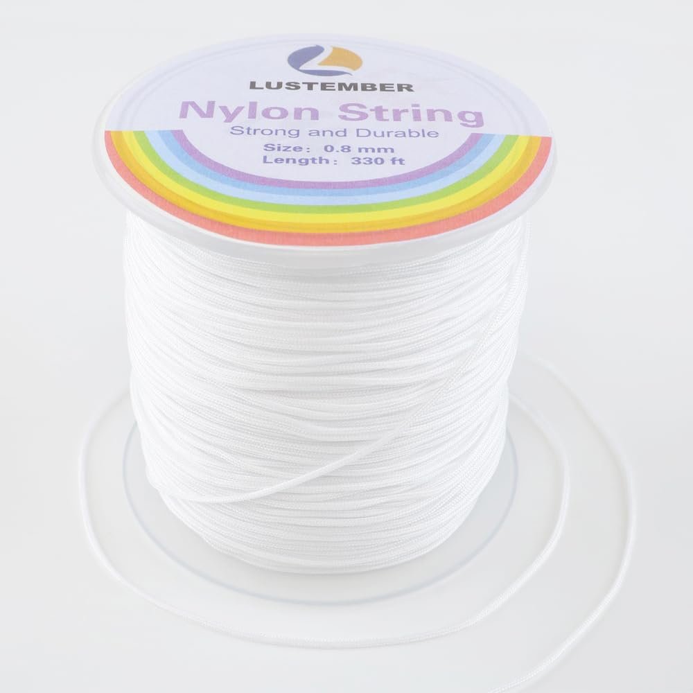 Spool of white 0.8mm nylon string for jewelry making, showing rainbow detail on spool label.
