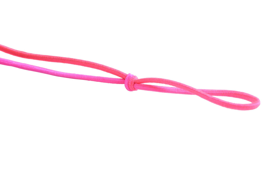 Two strands of pink elastic beading cord tied in a knot, isolated on white.