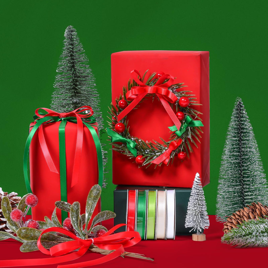 Christmas gift wrapping scene with red presents, assorted ribbons, and miniature trees