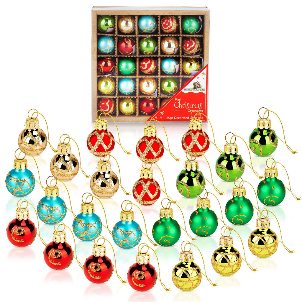 Set of 25 mini glass Christmas ornaments in red, blue, green, and gold, displayed in a box and scattered in front.