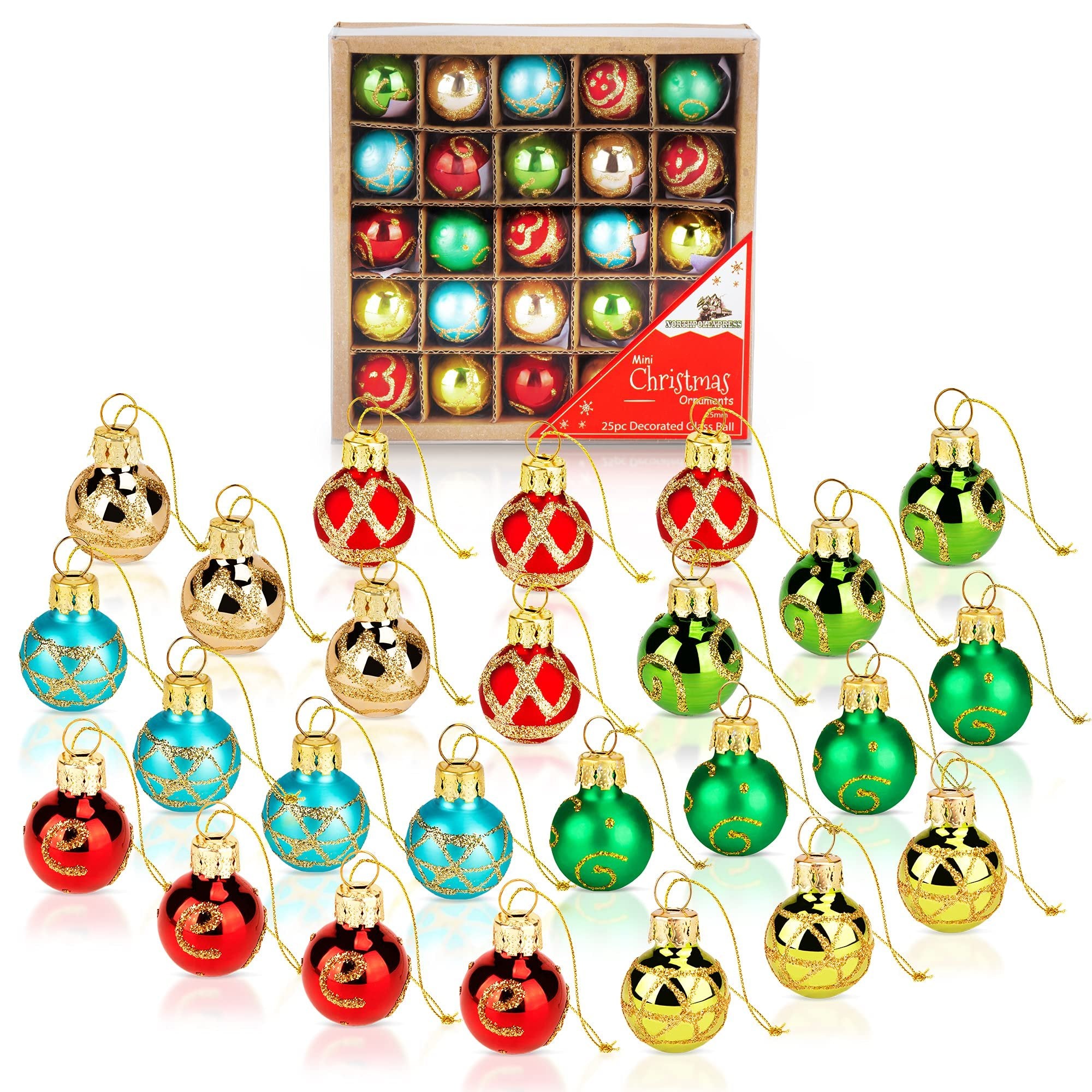 Set of 25 mini glass Christmas ornaments in red, blue, green, and gold, displayed in a box and scattered in front.