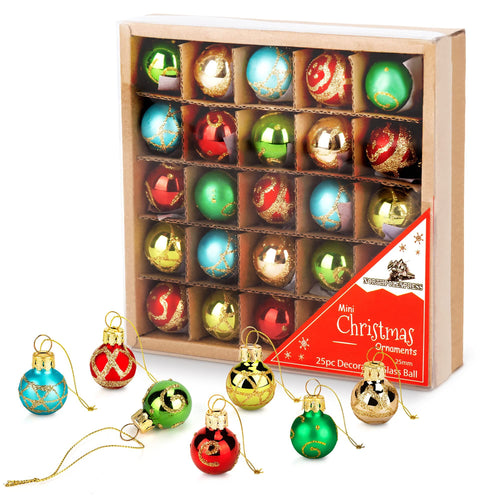 Set of 25 mini glass Christmas ornaments in red, blue, and gold, some displayed in a cardboard box and others scattered in front.