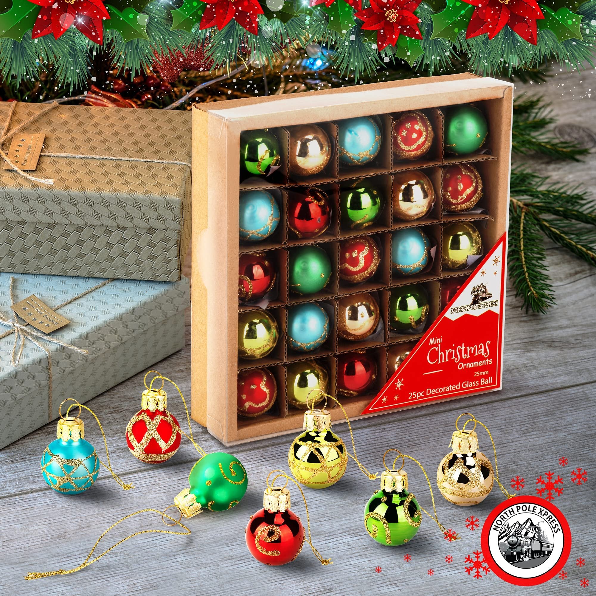 Set of 25 mini glass Christmas ornaments in red, blue, gold, and green, displayed in a box and scattered on a wooden surface with festive decorations.