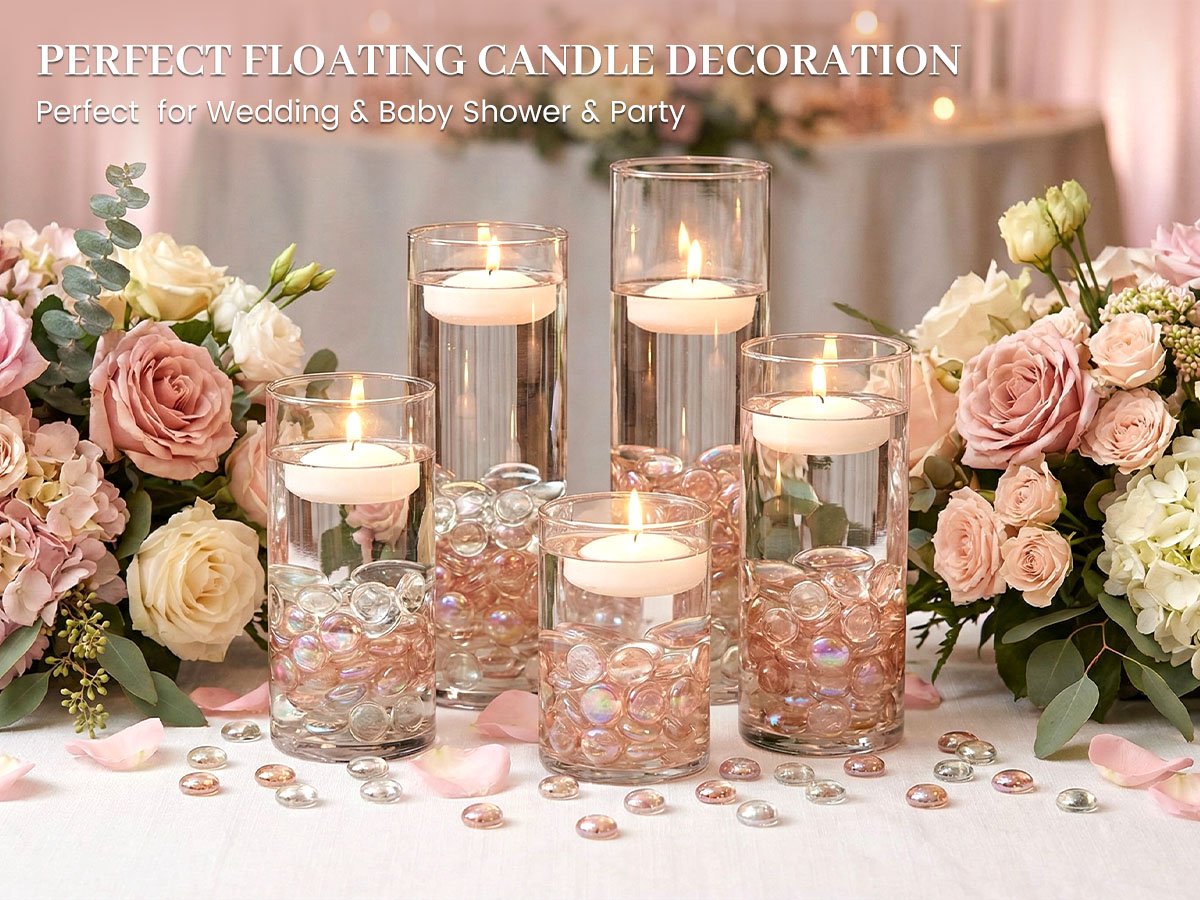 Five glass vases filled with water and iridescent glass beads, topped with floating candles, arranged with floral bouquets.