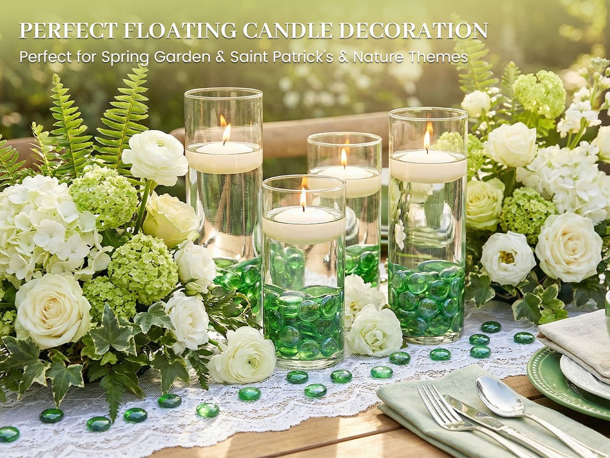 Glass cylinders with floating candles and green glass beads on a table with floral arrangements.