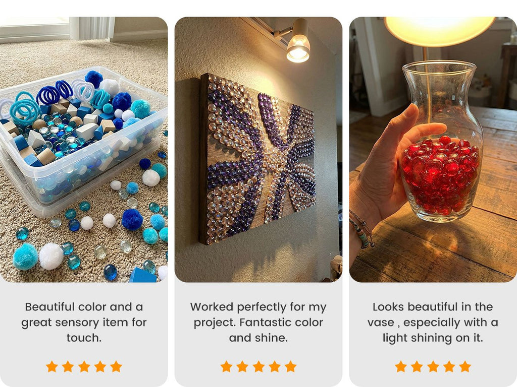 Three images showing glass marbles used in crafts and decor. Left: blue and white pom poms, wooden blocks, and clear glass marbles in a bin and scattered on carpet. Middle: a mosaic artwork made with purple and clear glass gems on a wooden board. Right: a hand holding a glass vase filled with red gl