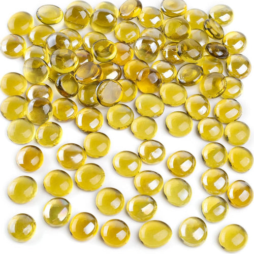 Pile of amber flat glass marbles, 0.6-0.7 inch diameter, scattered on a white background.