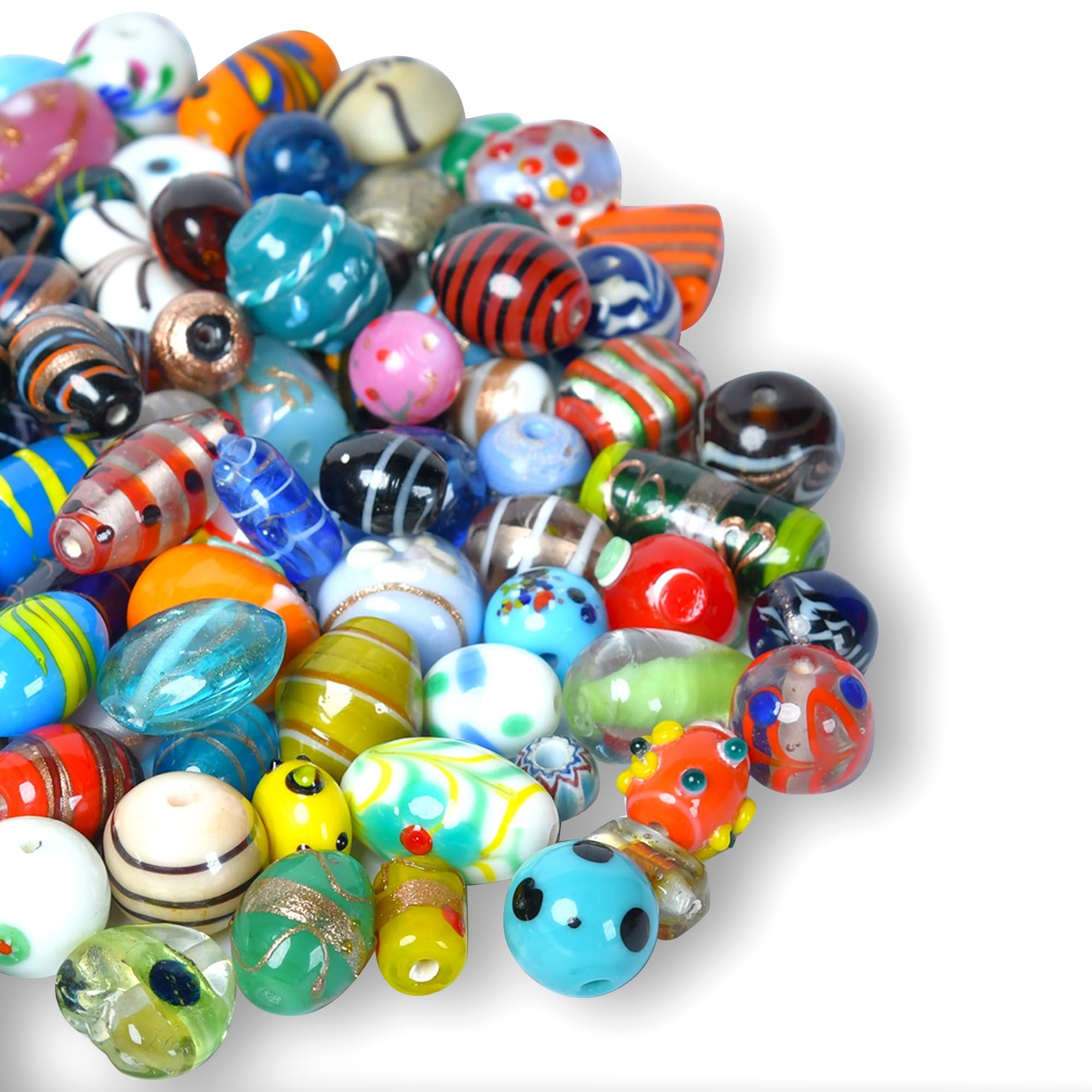 Assorted glass beads with colorful patterns and stripes, scattered on a white background.