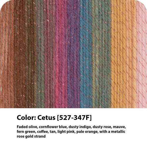 Close-up of Cetus multicolor yarn cake with metallic rose gold strands, showing vertical stripes of brown, green, purple, blue, and yellow.