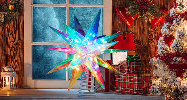 RGB LED Christmas tree topper star with multiple colors and lights, displayed on a windowsill with festive decorations.