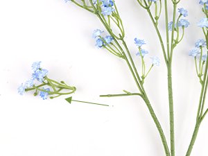 Artificial baby's breath bouquet with flexible stems, showing a detached cluster and a main stem on white background.