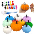 Paint-your-own pumpkin decorating kit with multiple colored pumpkins, paints, brushes, and palette
