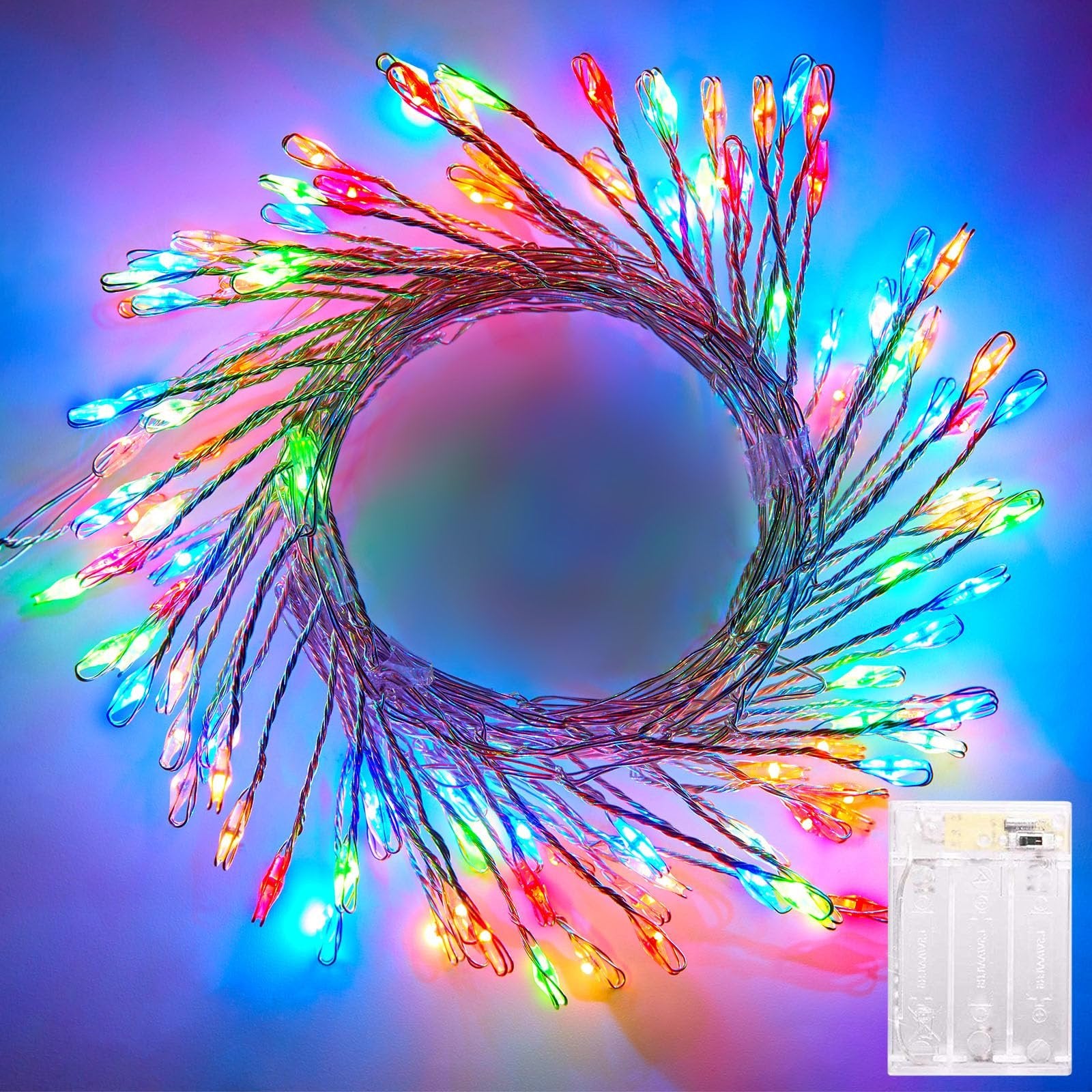 Close-up of multicolor firecracker fairy lights arranged in a circle, with a battery pack visible in the lower right corner.