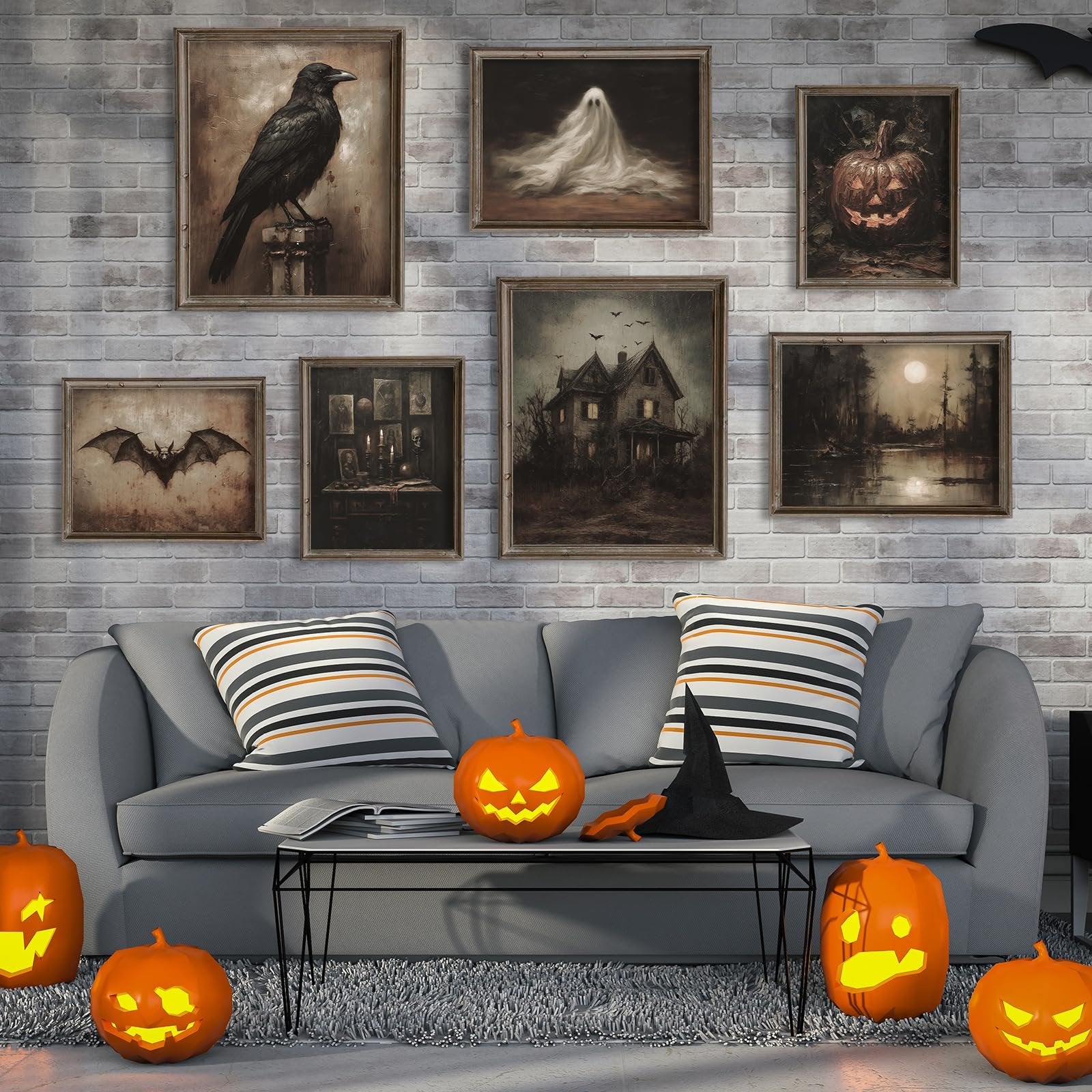 Living room scene with Halloween decor, featuring framed dark art prints of a crow, ghost, pumpkin, bat, haunted house, and moonlit landscape above a gray sofa with striped pillows and pumpkins.