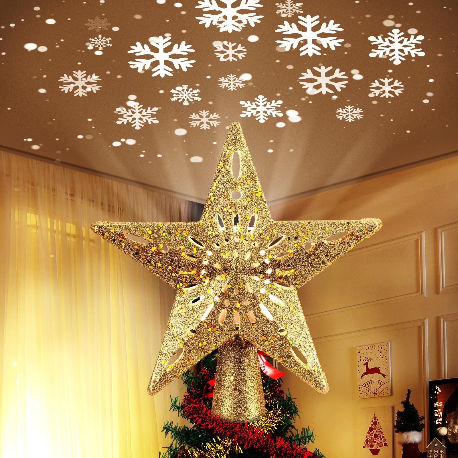 Golden glitter star Christmas tree topper with built-in LED snowflake projector casting snowflakes on the ceiling.