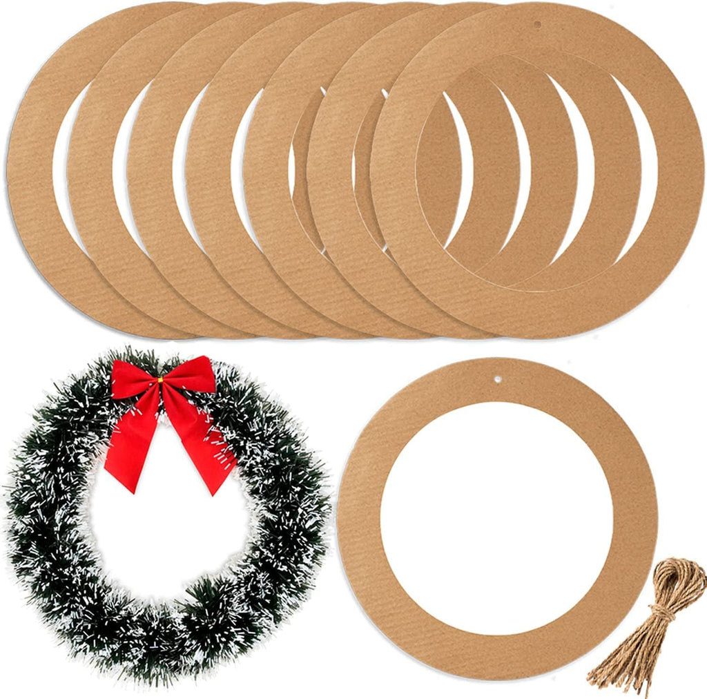 Ten cardboard wreath rings and a sample wreath with red bow, plus twine bundle