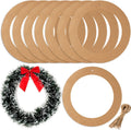 Ten cardboard wreath rings and a sample wreath with red bow, plus twine bundle