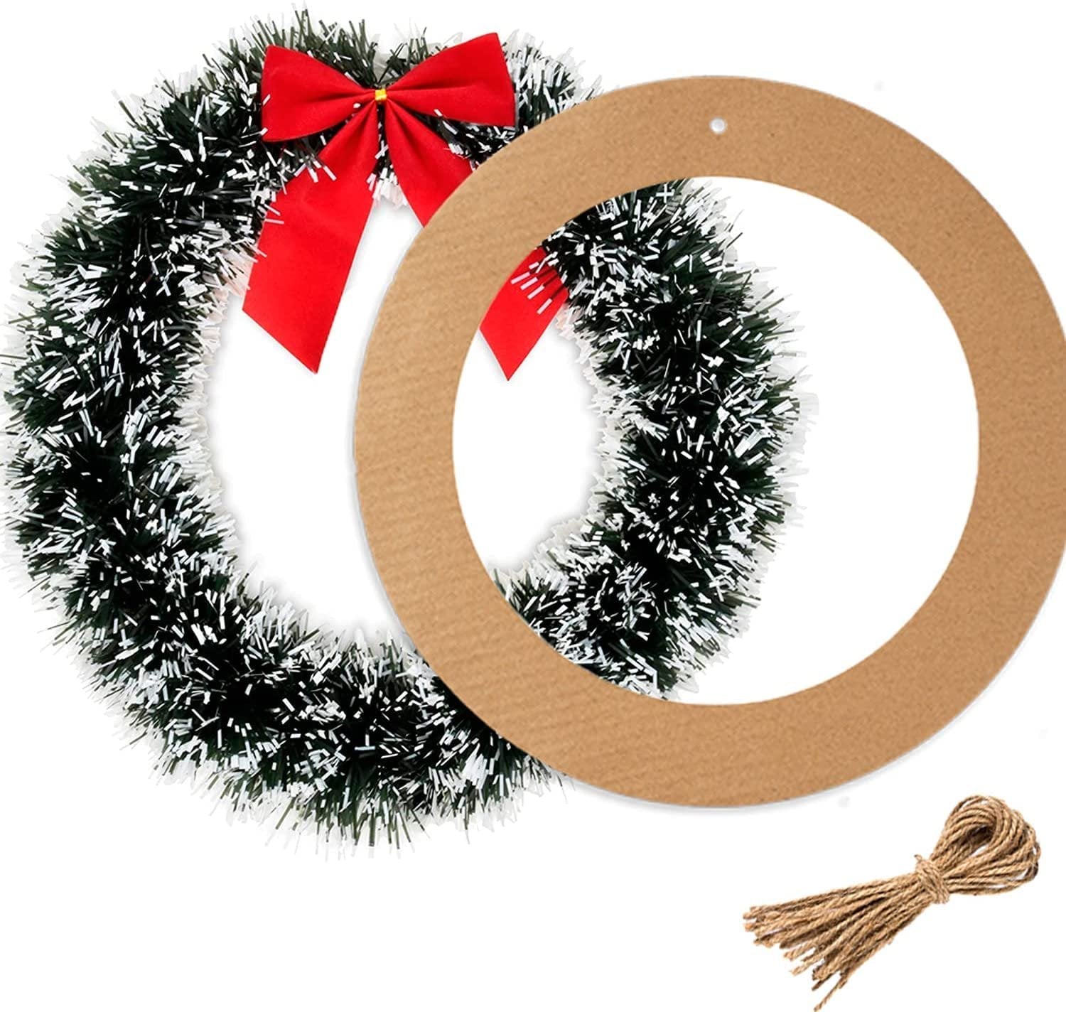 Cardboard wreath ring next to a green tinsel wreath with a red bow and a bundle of twine on a white background.