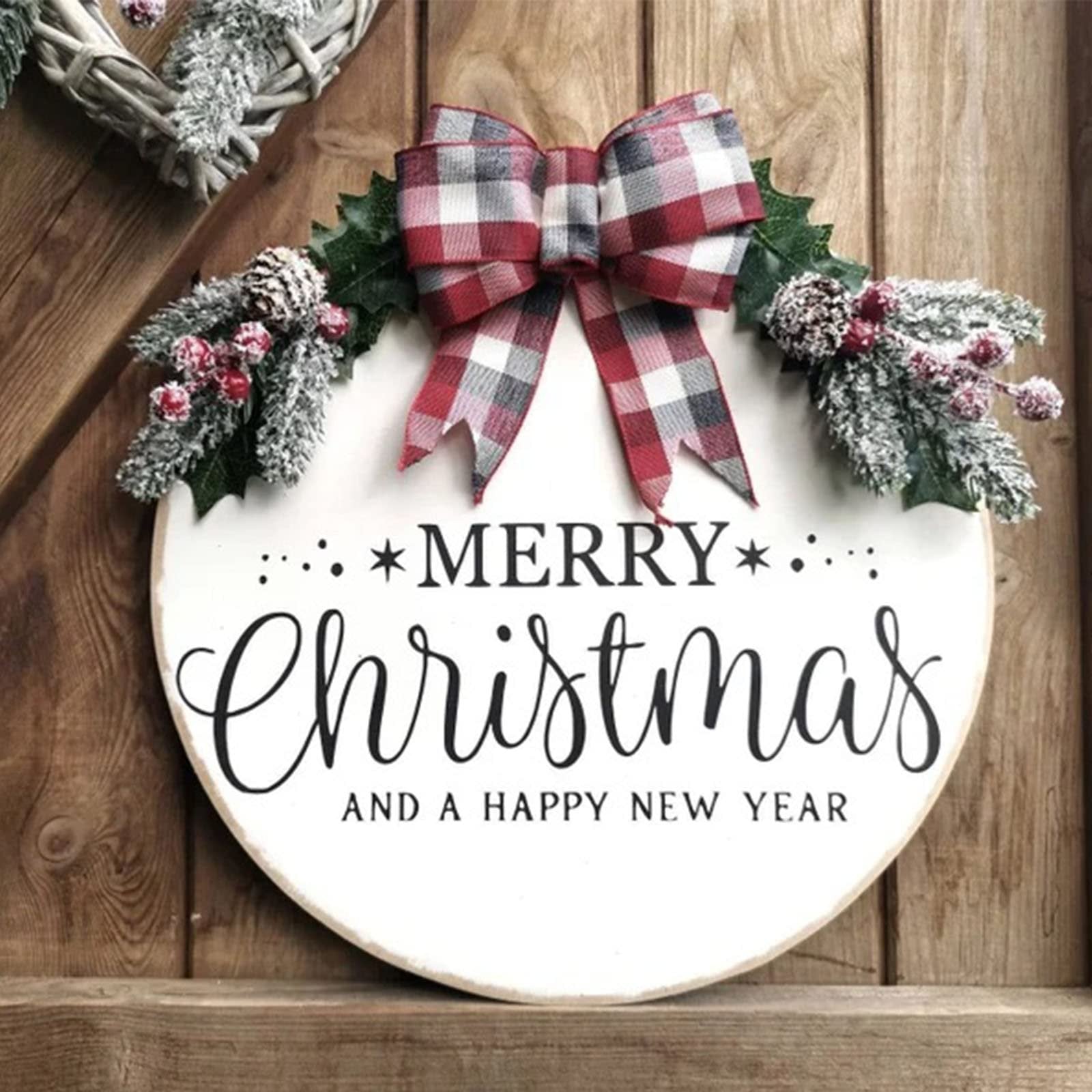 White wooden Christmas sign with a plaid bow and frosted pine sprigs, reading 'Merry Christmas and a Happy New Year'