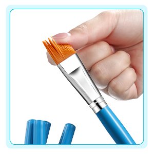 Hand holding a flat nylon paint brush with orange bristles and a sky blue handle.