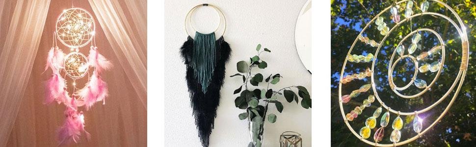 Three decorative wall hangings: a dream catcher with pink feathers and lights, a macrame wall hanging with fringe, and a spiral mobile with colorful beads.