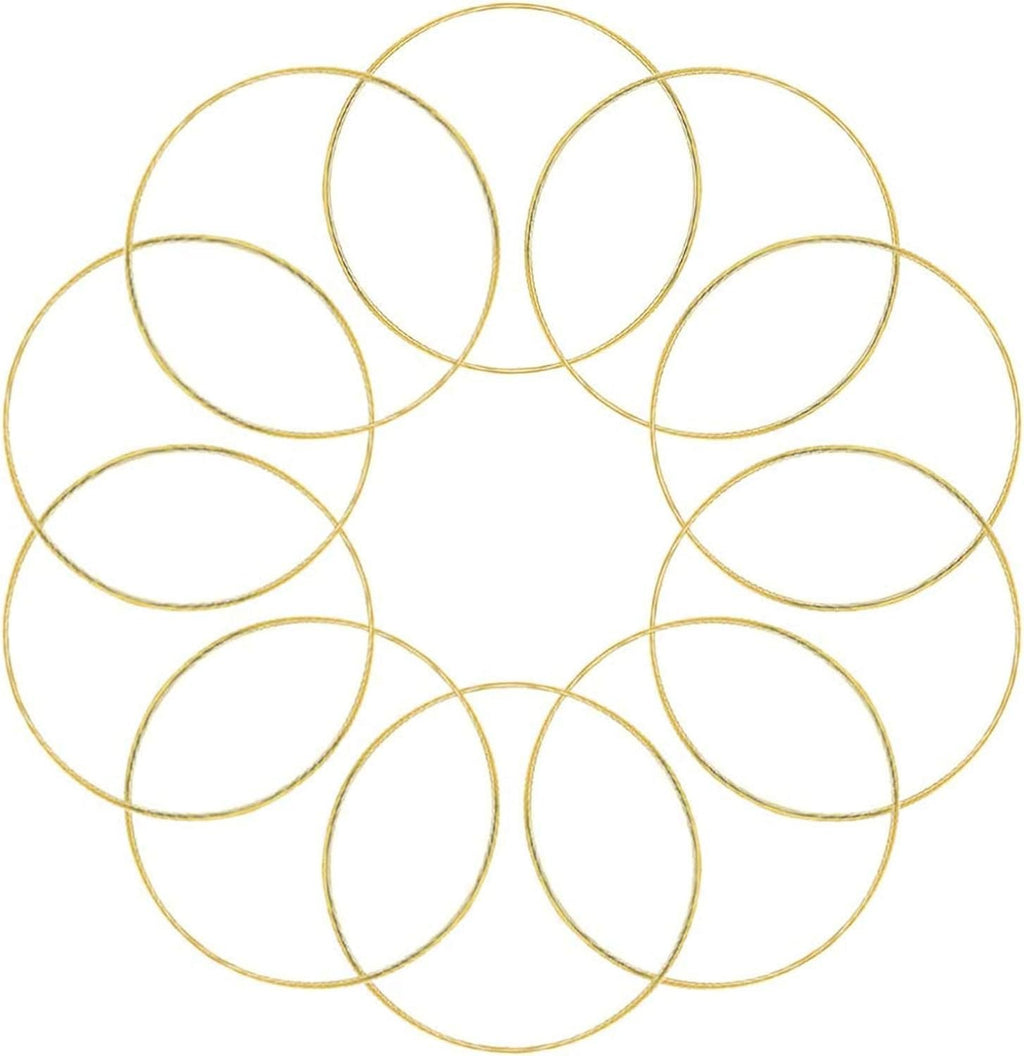 Ten gold metal rings arranged in a circular pattern on a white background, suitable for dream catchers and crafts.