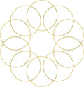 Ten gold metal rings arranged in a circular pattern on a white background, suitable for dream catchers and crafts.