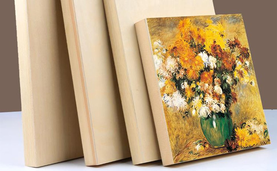 Unfinished birch wood cradled painting panels leaning against each other, one panel shows a floral painting.
