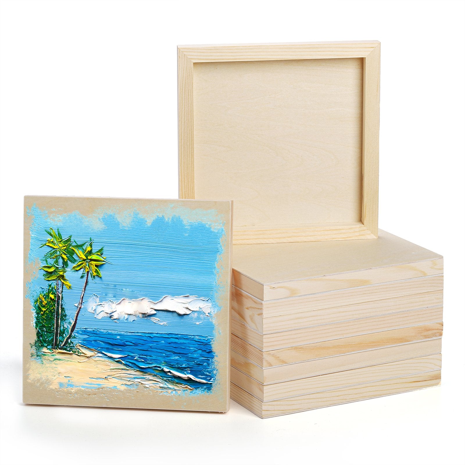 Stack of unfinished birch wood cradled painting panels with one panel showing a textured tropical beach painting