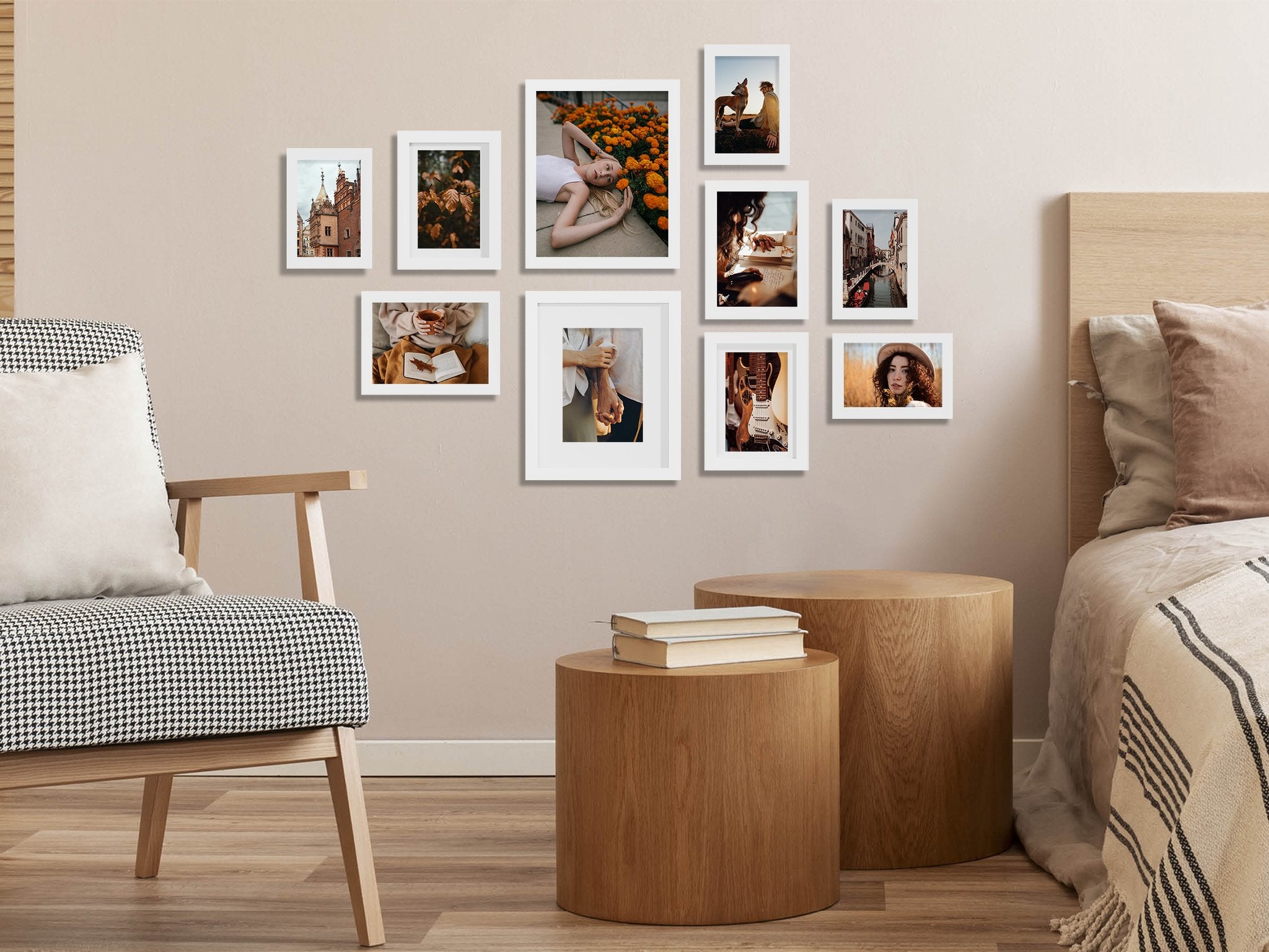 Gallery wall of ten white picture frames arranged on a wall above a chair and bedside tables, showcasing various lifestyle images.