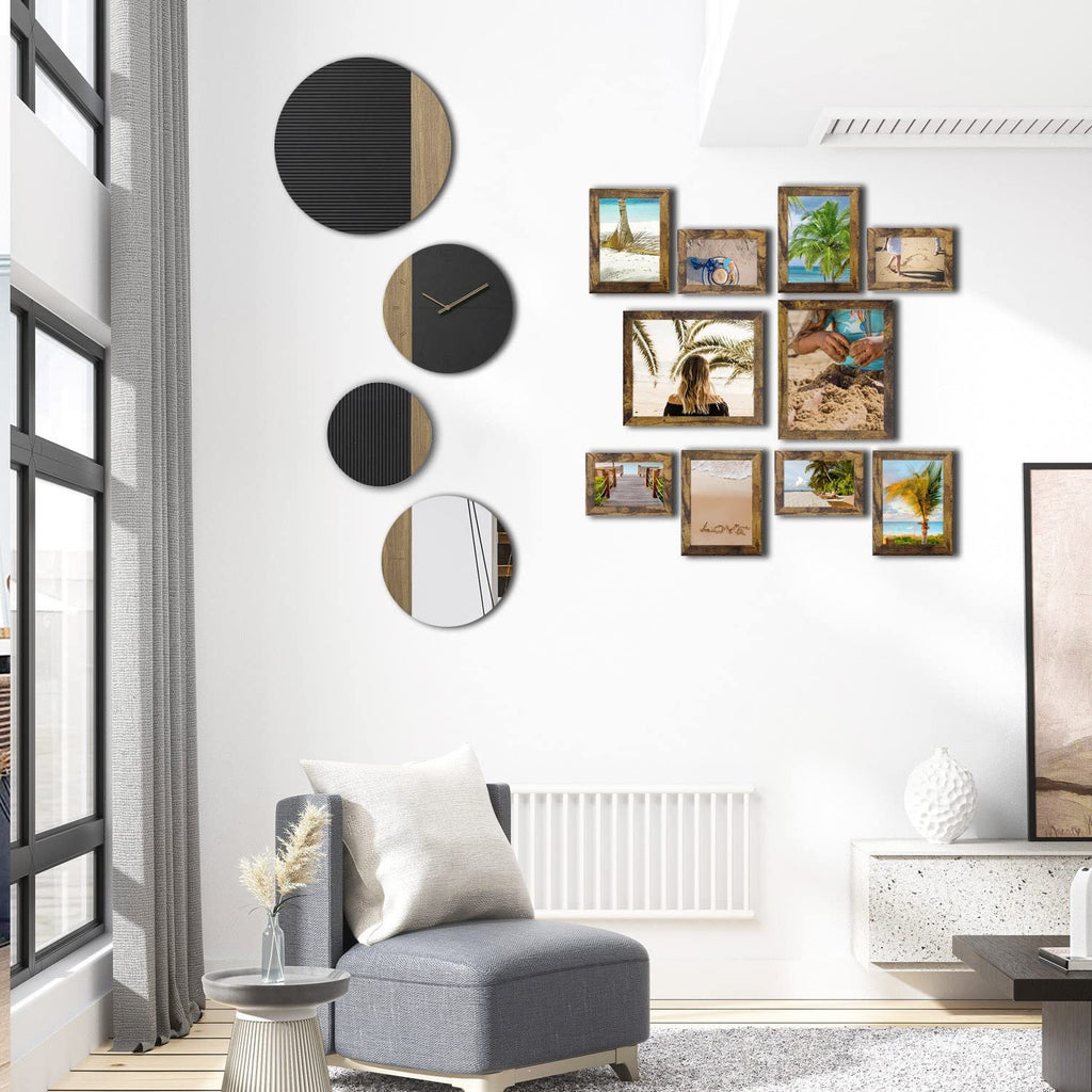 Gallery wall display with rustic brown picture frames and decorative clocks in a modern living room.