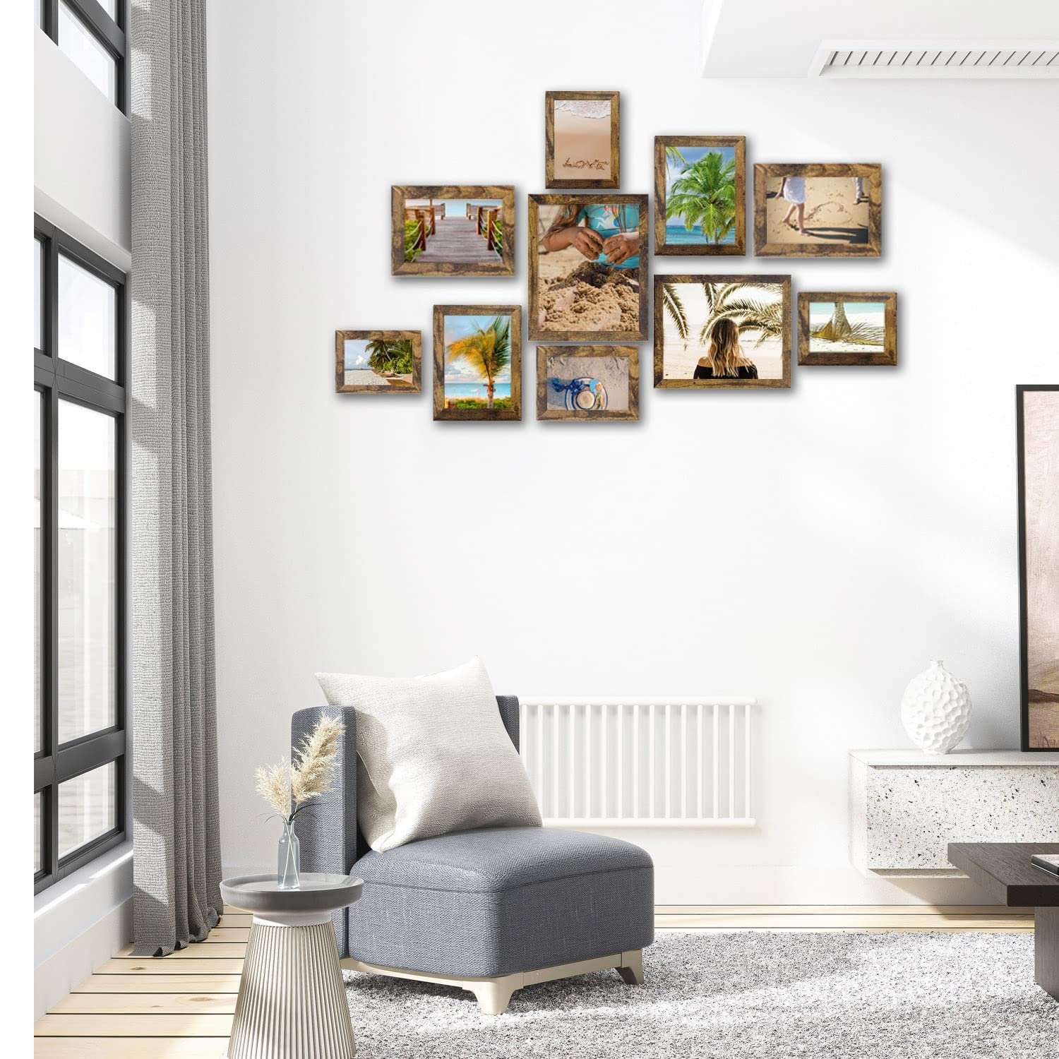 Gallery wall of ten rustic brown picture frames displaying beach-themed photos on a white wall.