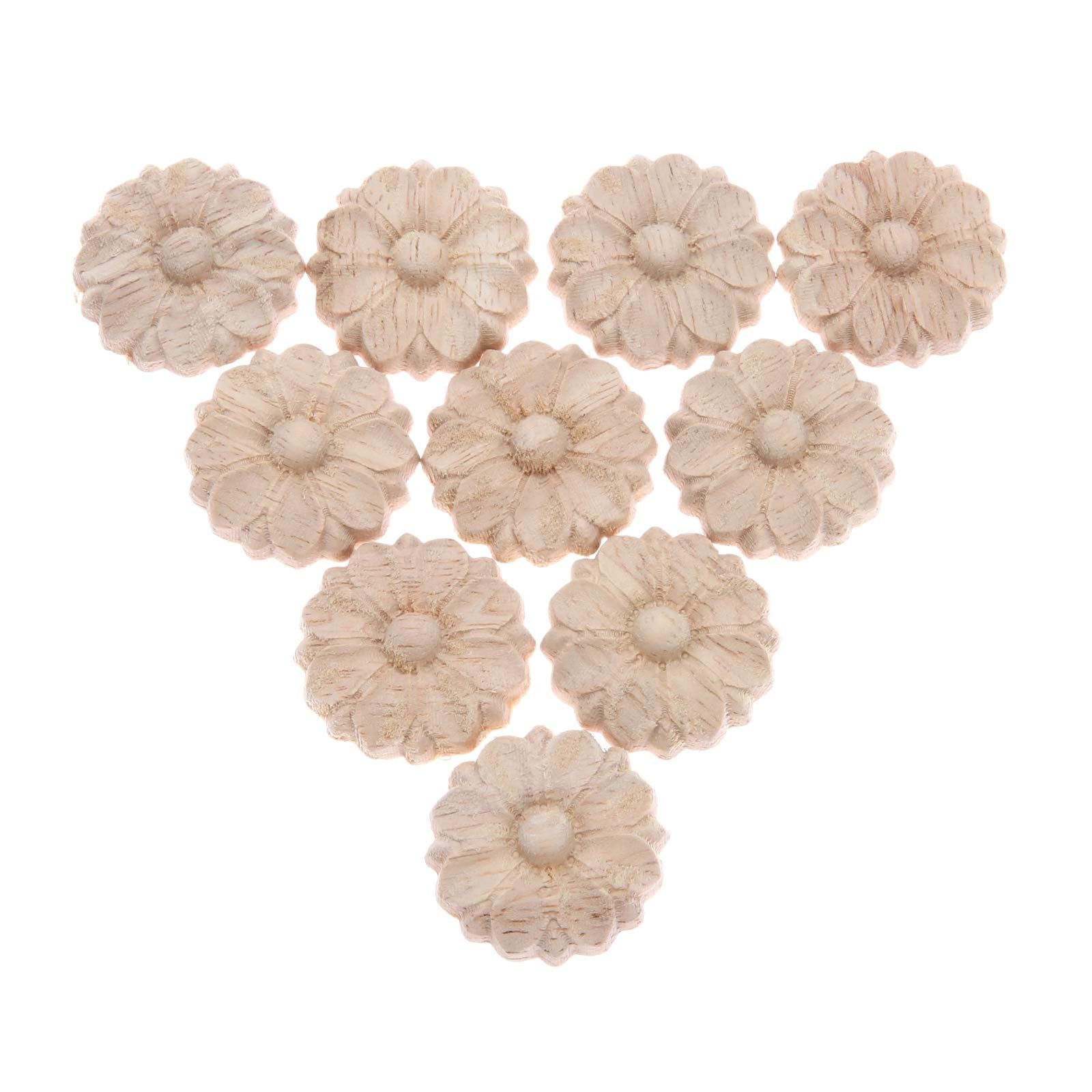 Ten unpainted wooden rosette onlay appliques arranged in a triangle on a white background.
