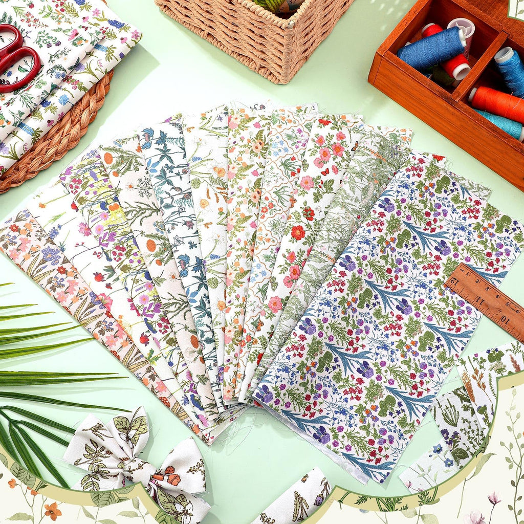 Ten floral fat quarter fabric bundles fanned out with a ruler and sewing supplies in the background.