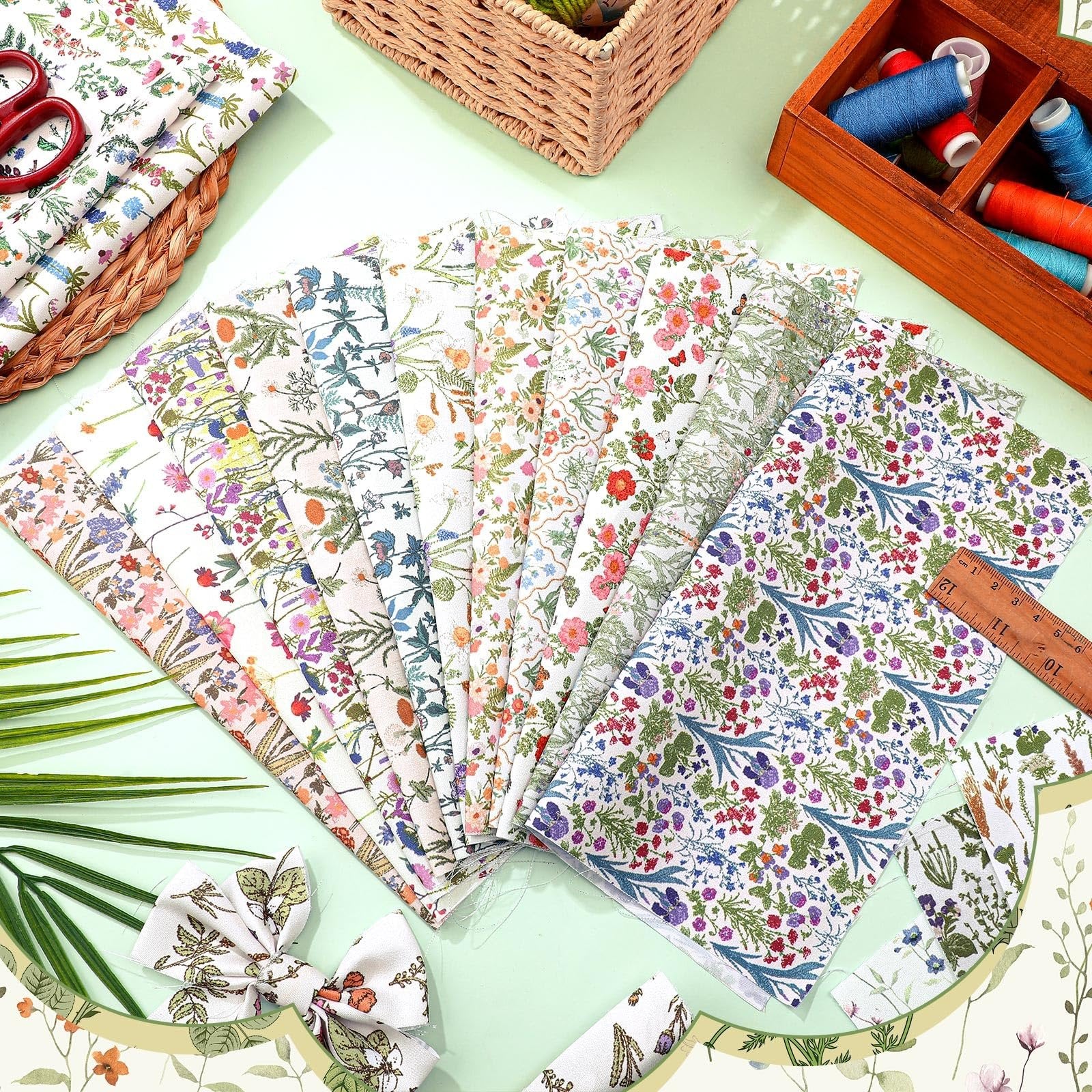 Ten floral fat quarter fabric bundles fanned out with a ruler and sewing supplies in the background.
