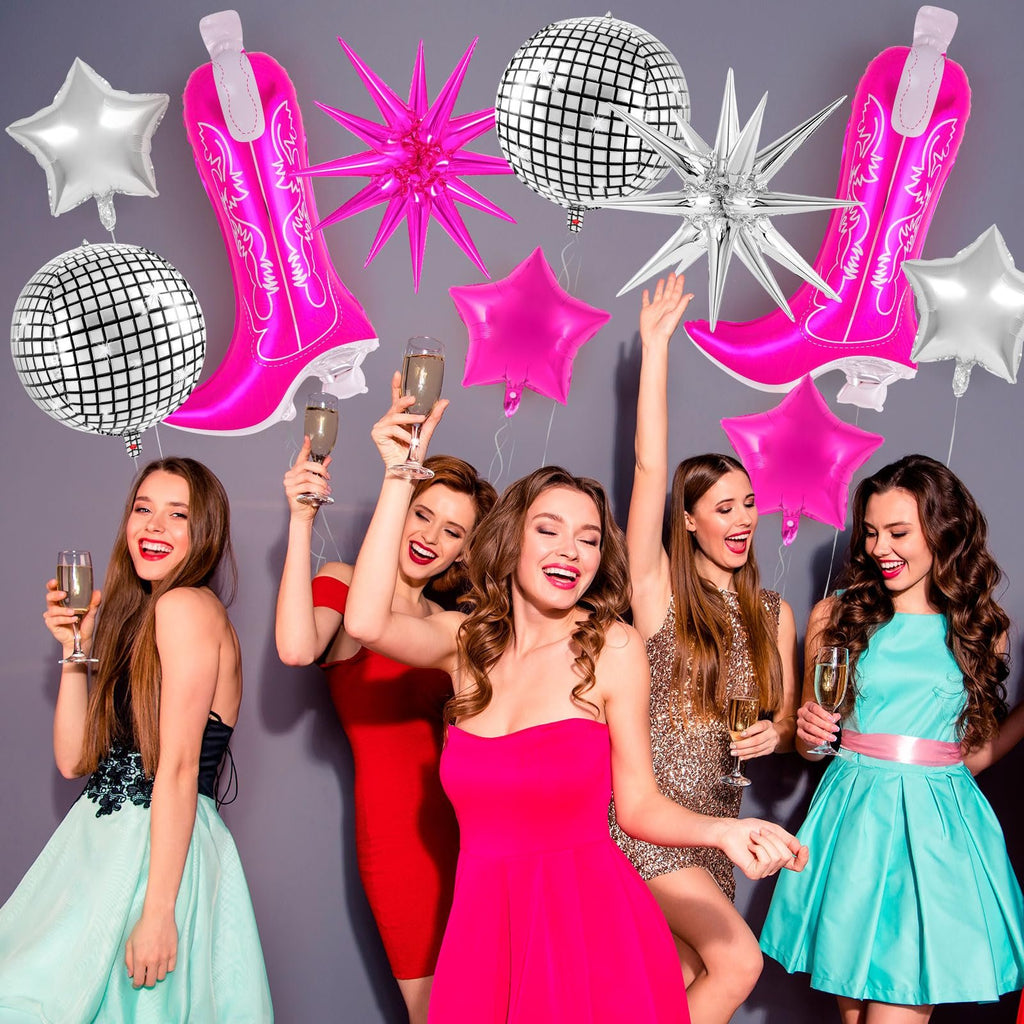 Group of women celebrating with pink cowgirl boot and disco ball balloons