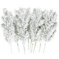 Group of 10 frosted artificial pine needle branches with white snow effect, on white background