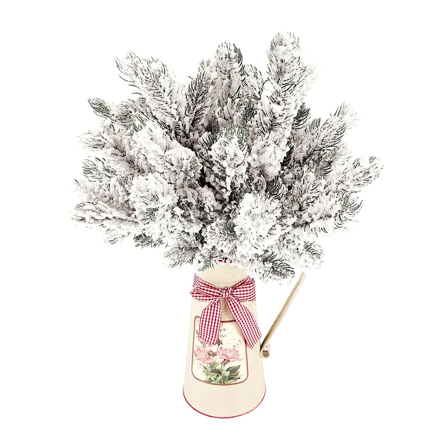 Frosted artificial pine needle branches in a decorative watering can with a red and white checkered ribbon and floral decal.