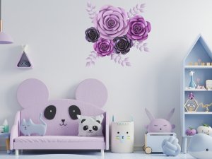 Purple and lavender 3D paper roses with leaves wall decoration adhered to a white wall above a child's sofa.