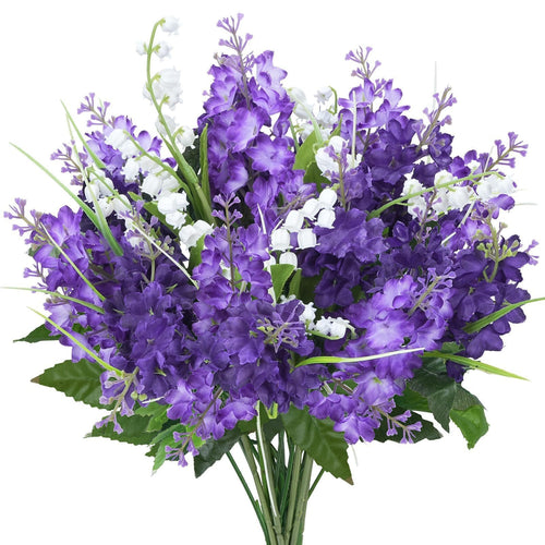 Bouquet of purple artificial lilac and white campanula flowers with green leaves, presented against a white background.