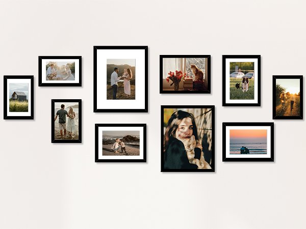 Collage of ten black picture frames displaying various family and pet photos on a white wall.