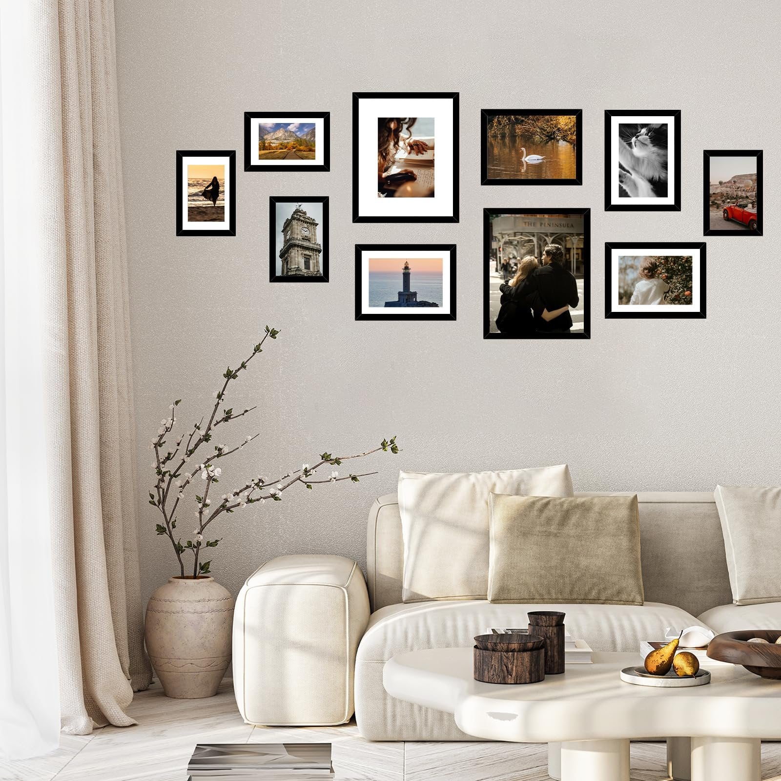 Collage of ten black picture frames displaying various scenic photos and portraits, arranged on a textured wall above a sofa.