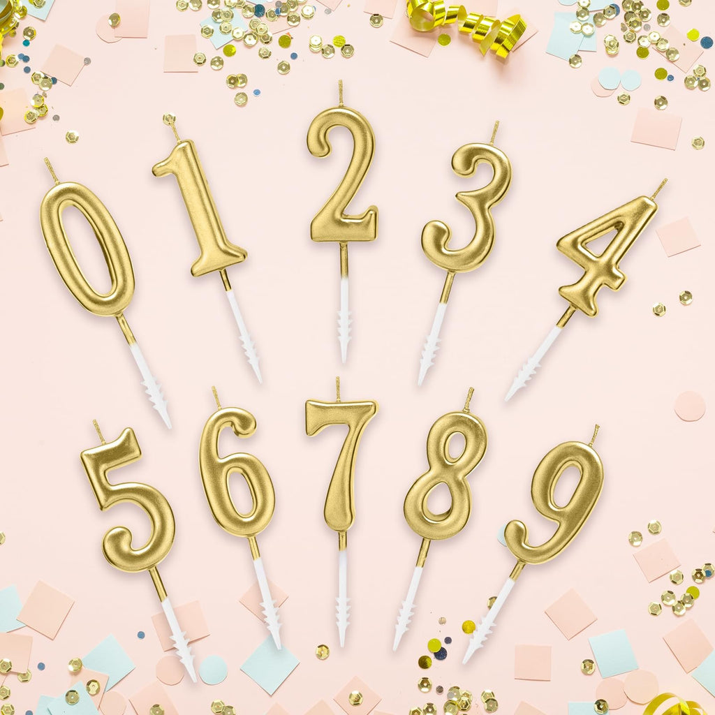 Ten gold numeral birthday candles, 0 through 9, arranged on a pink background with confetti and streamers.