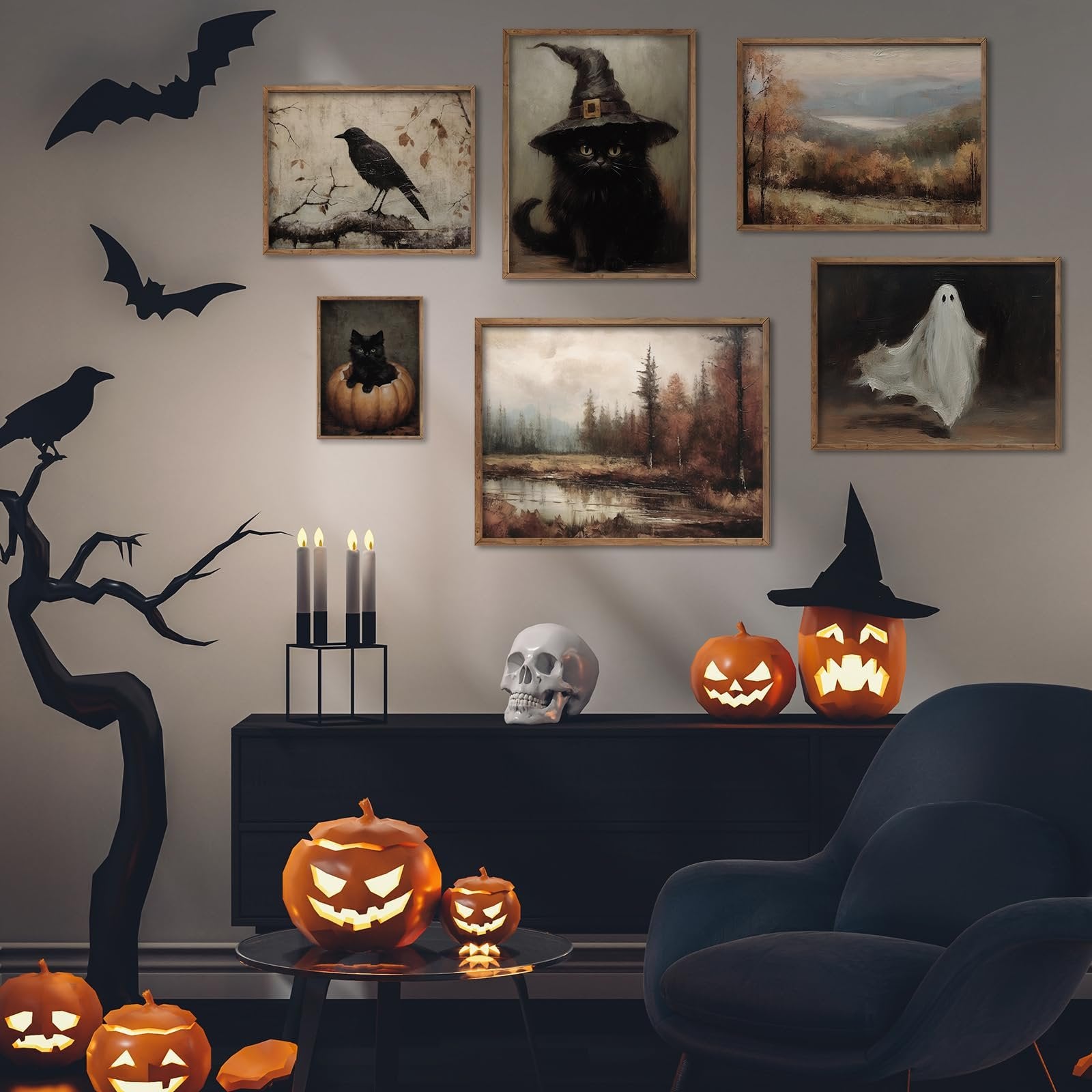Halloween gothic wall art prints displayed in a room with pumpkins, bats, and a skull