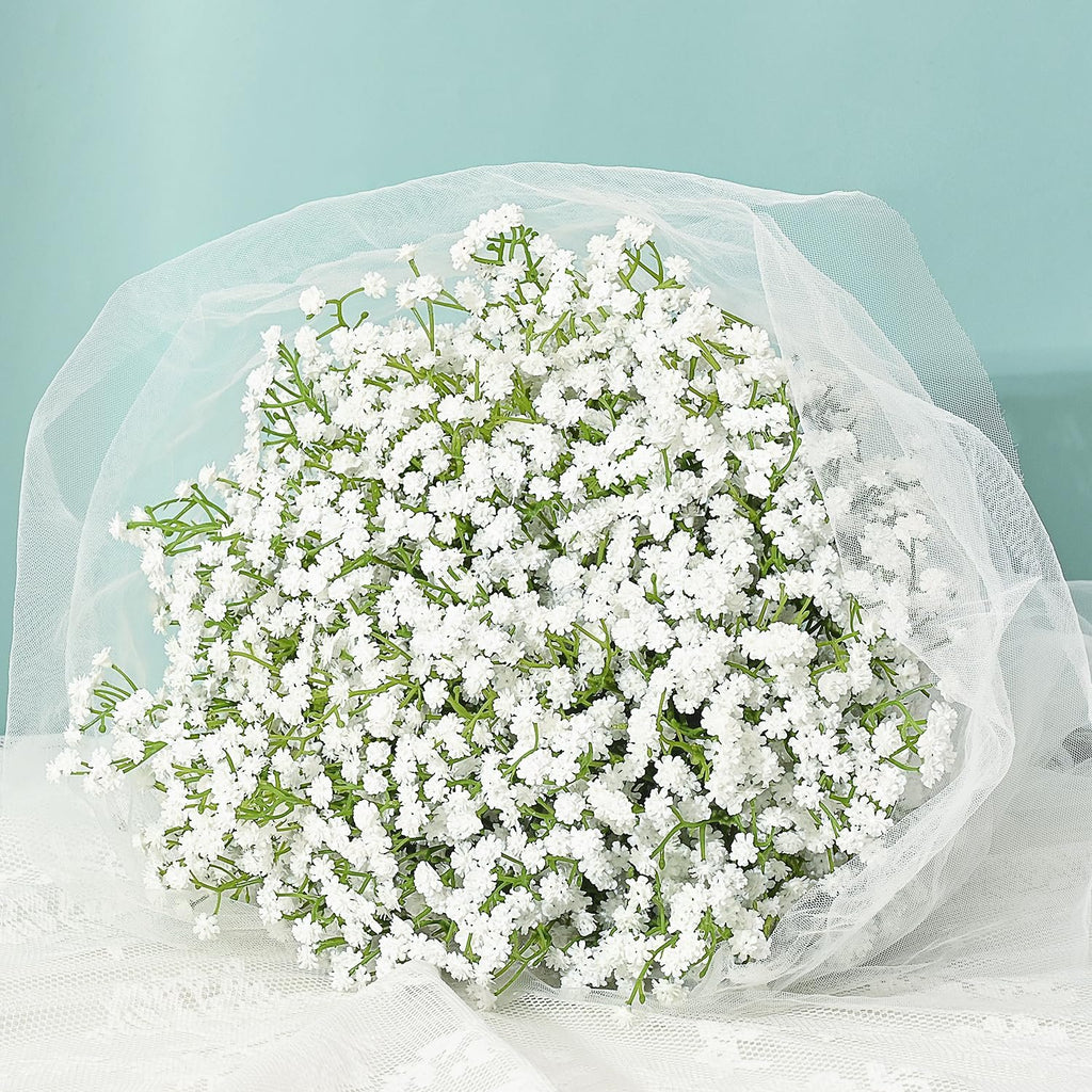 Bouquet of white artificial baby's breath flowers wrapped in white tulle and lace