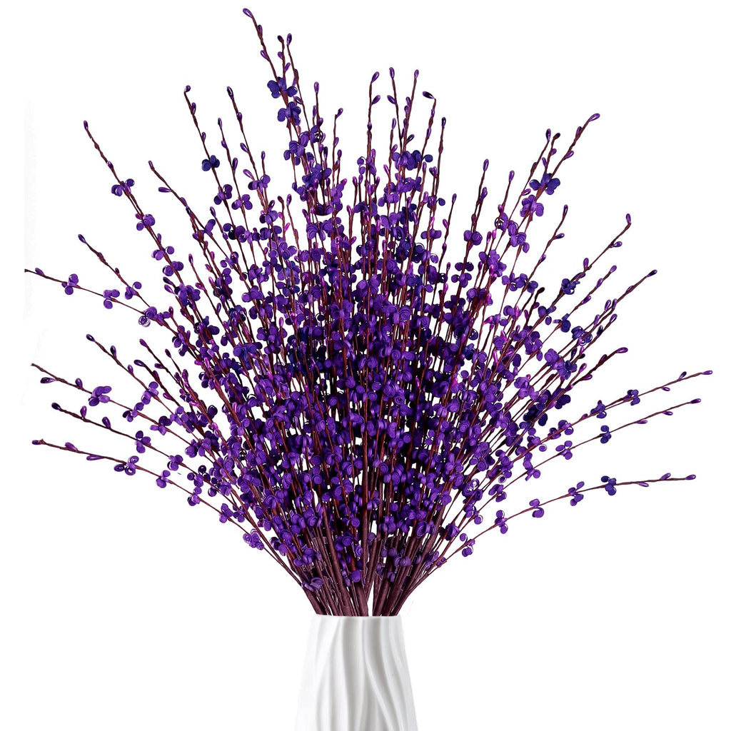 Bouquet of dark purple artificial jasmine flowers in a white vase, close-up view