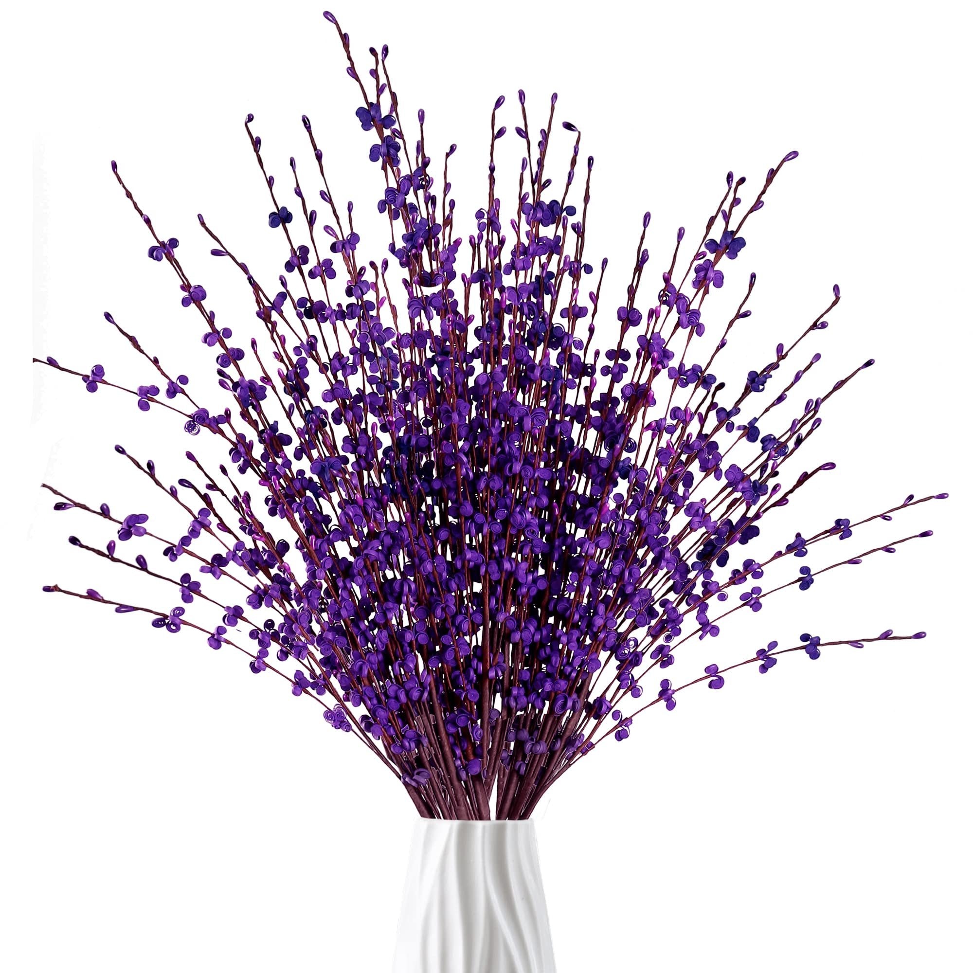 Bouquet of dark purple artificial jasmine flowers in a white vase, close-up view