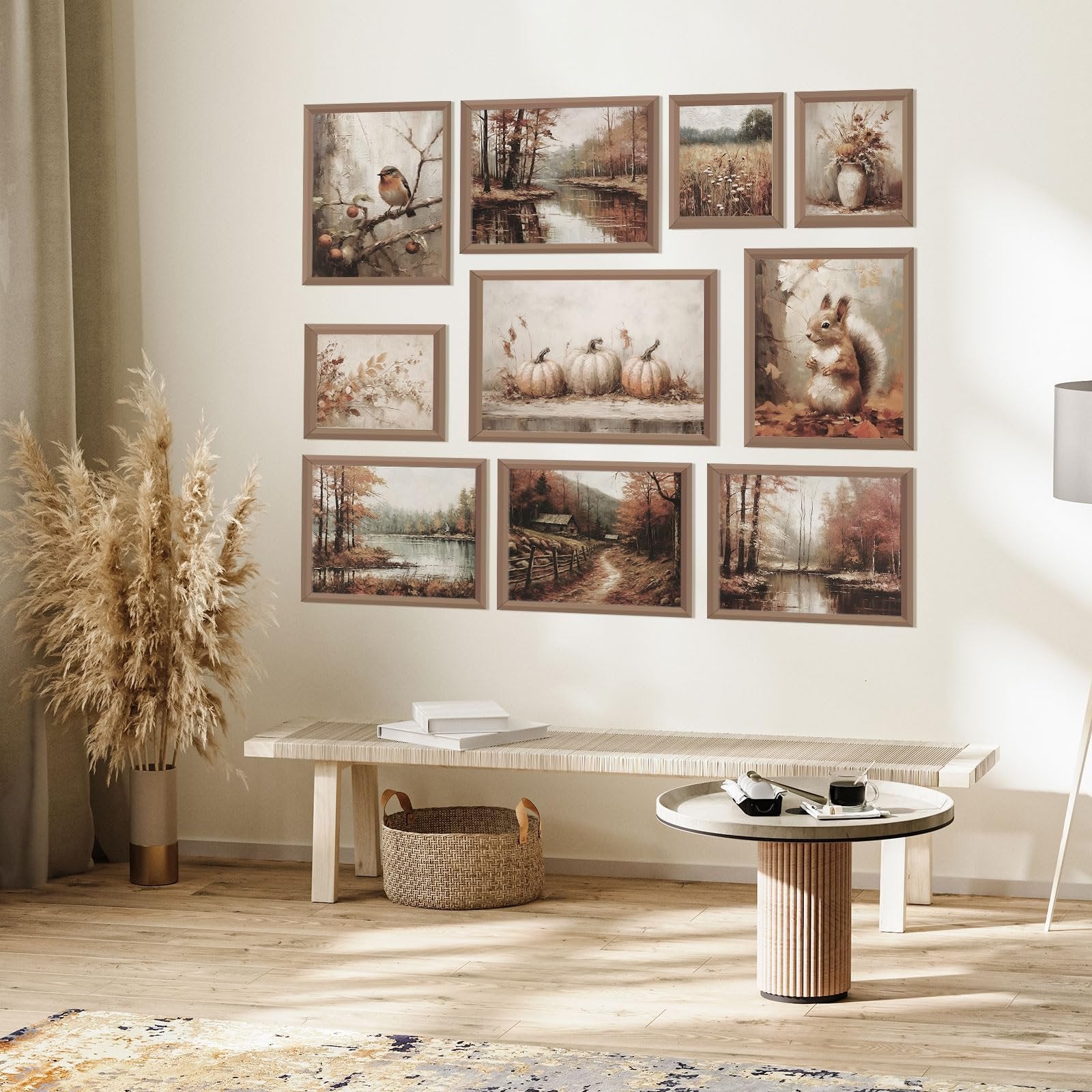 Nine framed vintage fall wall art prints displayed on a wall above a bench and coffee table.