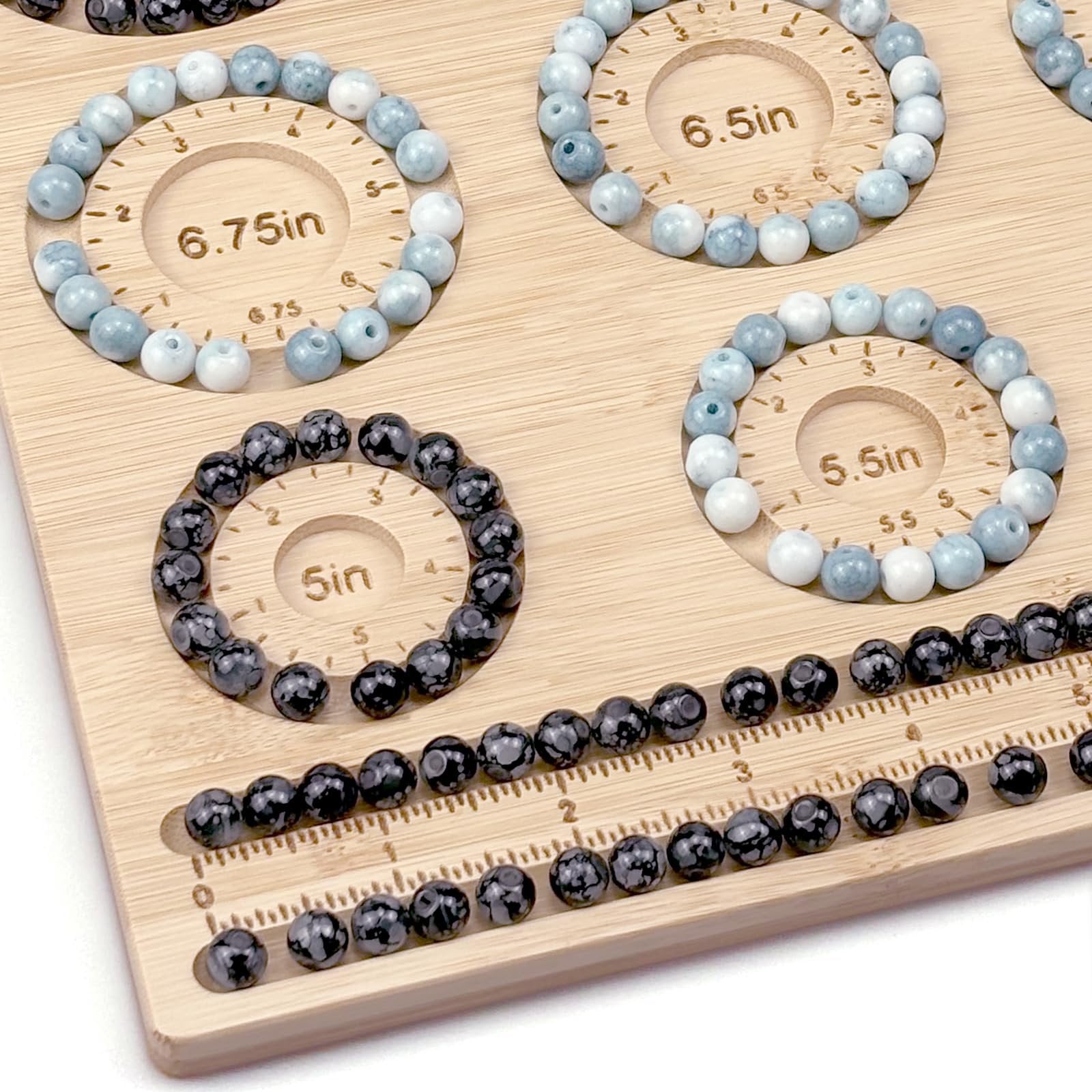 Bamboo beading board with bracelets arranged in grooves, showing sizes 6.75in, 6.5in, 5.5in, and 5in.